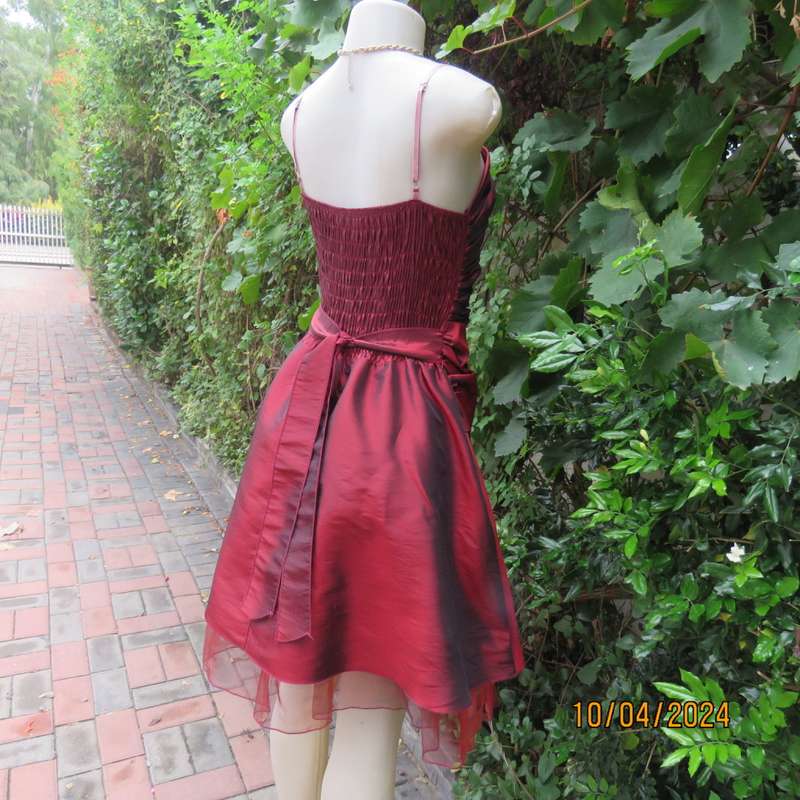 Chic garnet red polyester satin dress. Ruched top front. Skater skirt. Size 36.