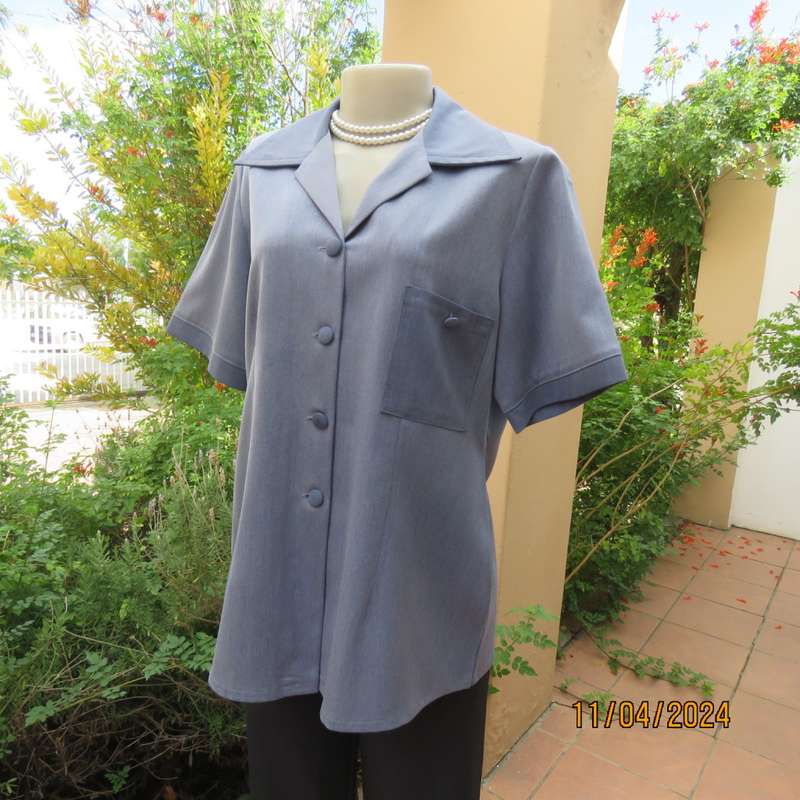 Boutique made short sleeve button down top in blues Polyester-viscose. Size 38.