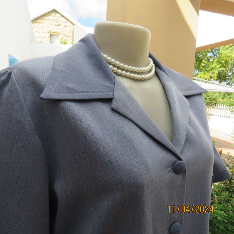 Boutique made short sleeve button down top in blues Polyester-viscose. Size 38.