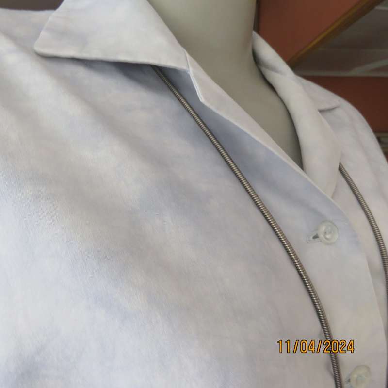 Classic long sleeve top in white/blue marble pattern. Open collar.Button down. Size 40.