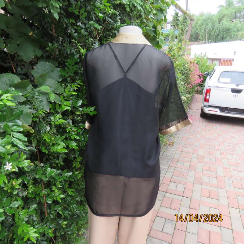 Up the luxe with this sheer black/gold satin button down top/gold shirt collar. Size 42. New cond.
