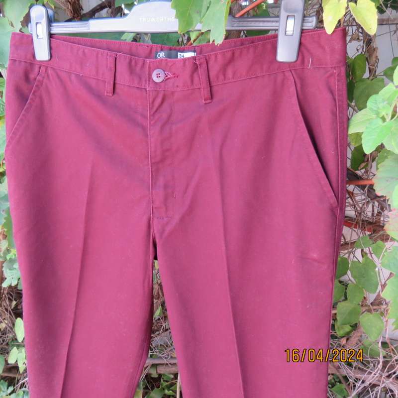 Casual men`s straight leg dark maroon Chino pants in polycotton, Size 34 by OR, New condition.