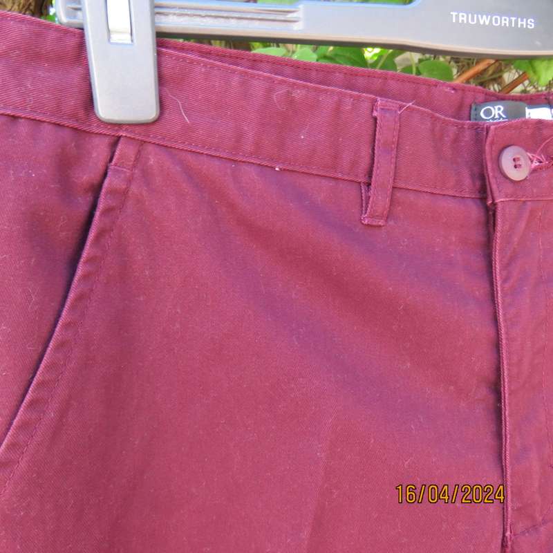 Casual men`s straight leg dark maroon Chino pants in polycotton, Size 34 by OR, New condition.