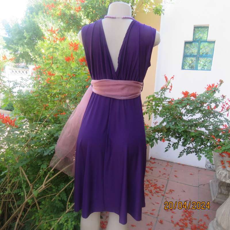 Smart casual purple stretch polyester calf length dress. Low V cross over top. Size 38. As new cond.