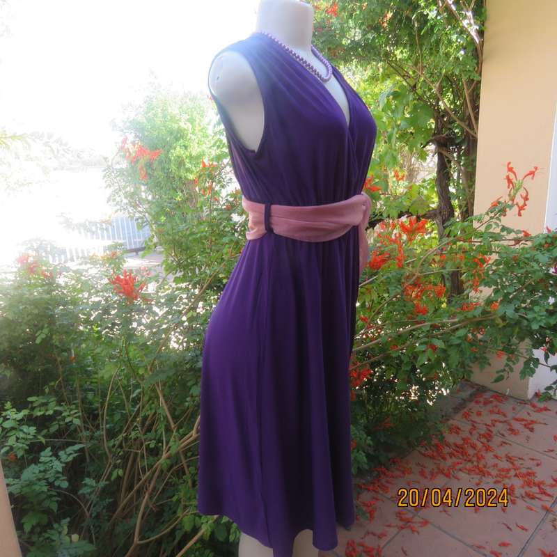 Smart casual purple stretch polyester calf length dress. Low V cross over top. Size 38. As new cond.