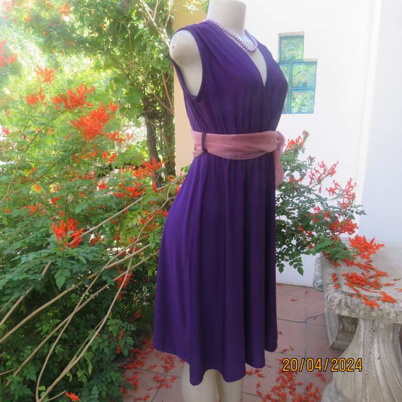 Smart casual purple stretch polyester calf length dress. Low V cross over top. Size 38. As new cond.