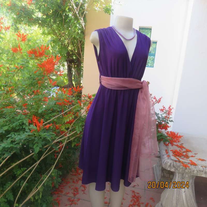 Smart casual purple stretch polyester calf length dress. Low V cross over top. Size 38. As new cond.