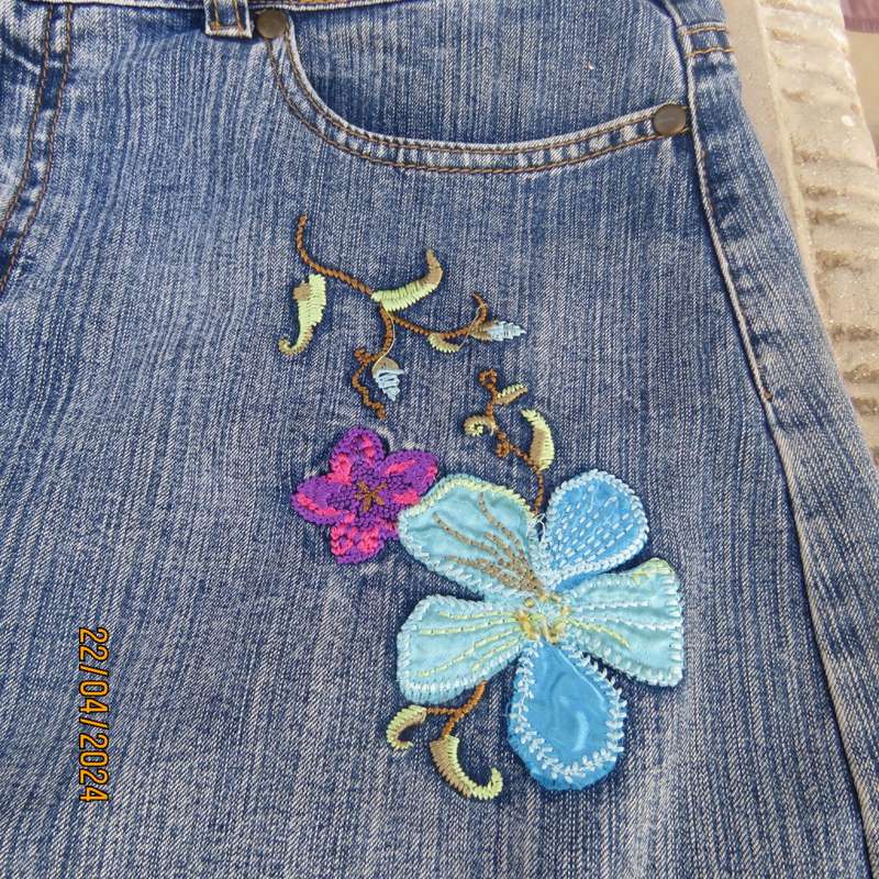 Sexy blue denim jean mini skirt size 38 by FASHION EXPRESS. Stretch cotton. Floral emb/applique patt