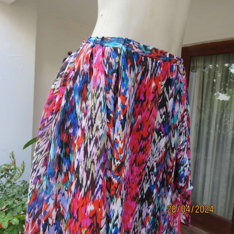 Cheerful sheer polyester gathered skirt/elastic waist. Array of colours. Size 36.Asymmetrical waist