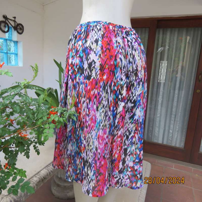 Cheerful sheer polyester gathered skirt/elastic waist. Array of colours. Size 36.Asymmetrical waist