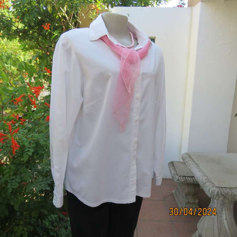 Ladies long sleeve white stretch cotton shirt. Size 42. No label. Button down/shirt collar.As new