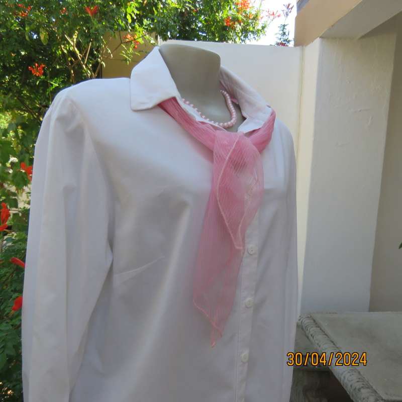 Ladies long sleeve white stretch cotton shirt. Size 42. No label. Button down/shirt collar.As new
