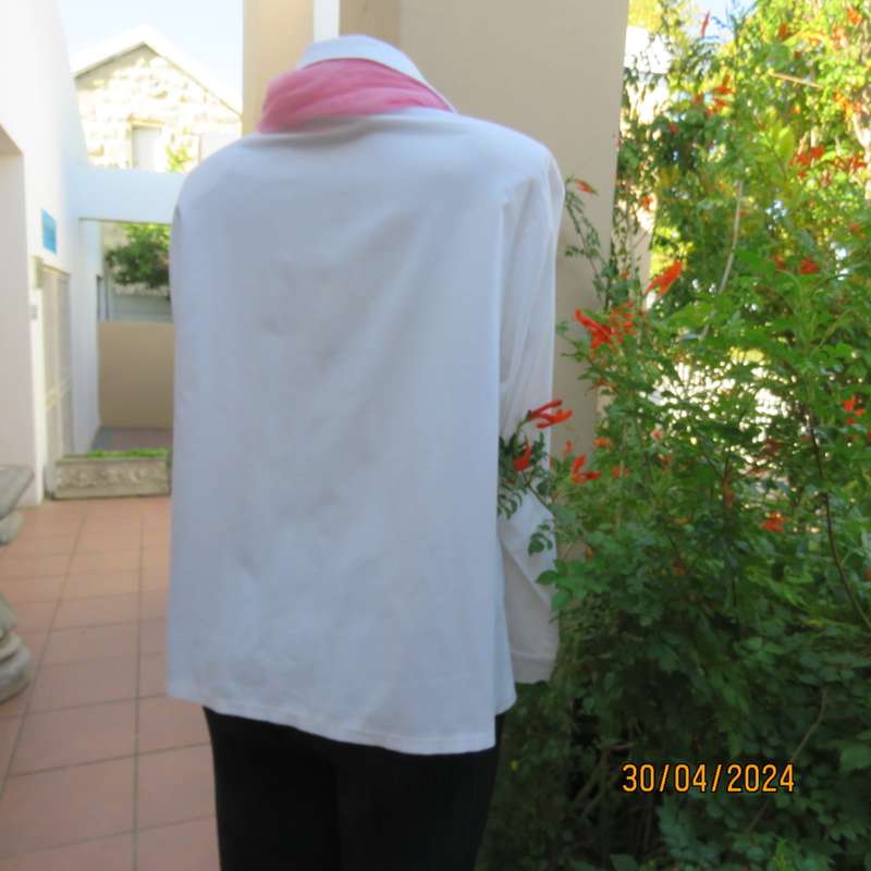 Ladies long sleeve white stretch cotton shirt. Size 42. No label. Button down/shirt collar.As new