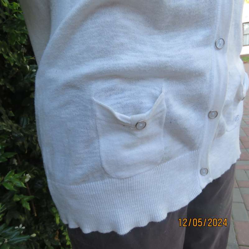 Soft cream cotton/rayon knit button down top. Scooped neckline. Elbow roll up sleeves.By TRU size 38