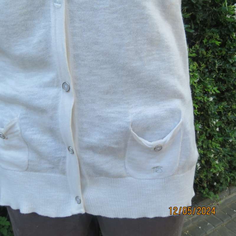 Soft cream cotton/rayon knit button down top. Scooped neckline. Elbow roll up sleeves.By TRU size 38