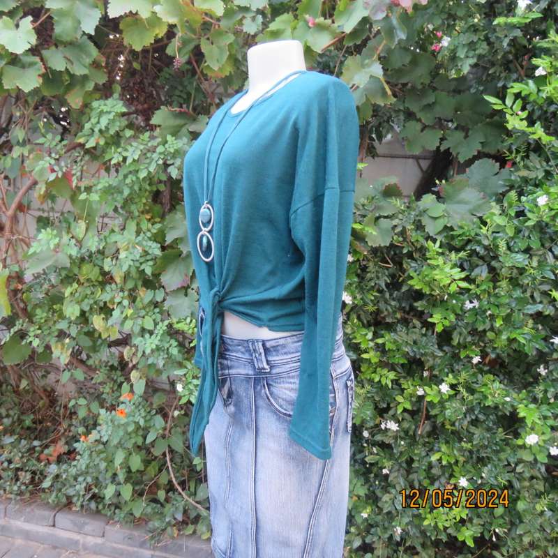 Pretty soft warm acrylic knit long sleeve  top with stretch. Straps to tie on front. Size 38. As new