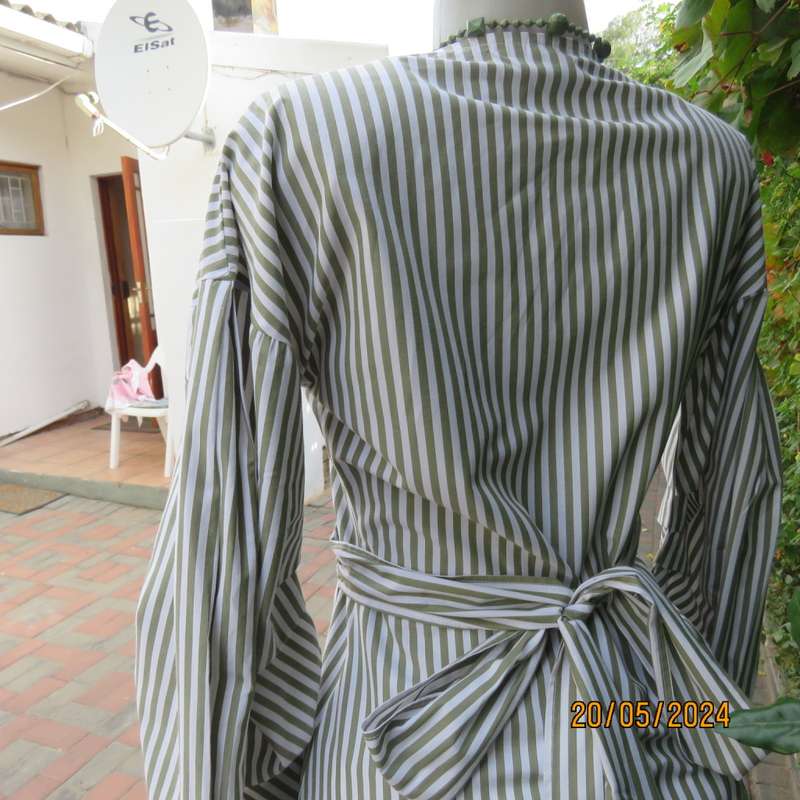 Look at me fold over V neck polycotton peplum style top. White/olive stripes. Unique sleeves.Size 34