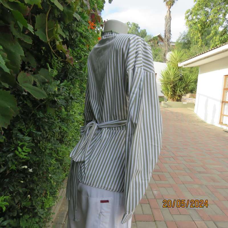 Look at me fold over V neck polycotton peplum style top. White/olive stripes. Unique sleeves.Size 34