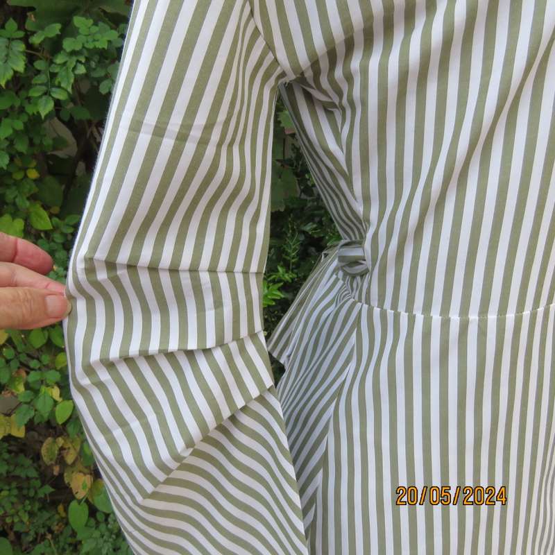 Look at me fold over V neck polycotton peplum style top. White/olive stripes. Unique sleeves.Size 34