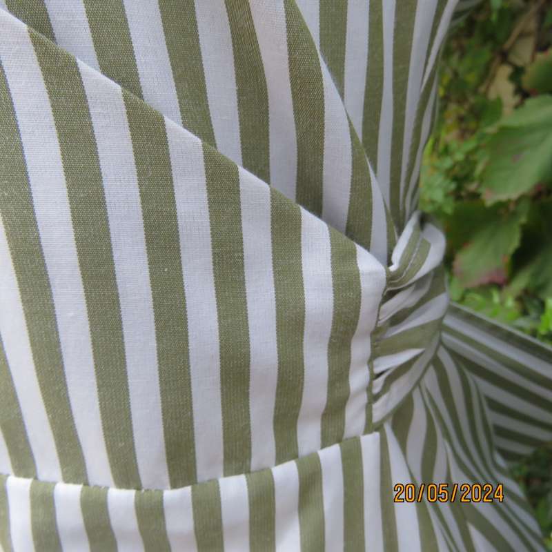Look at me fold over V neck polycotton peplum style top. White/olive stripes. Unique sleeves.Size 34