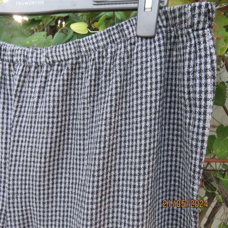 Warm black/grey check pants 70cm inner leg. Elasticated waist. Size 46/22. Owner made.Very good cond