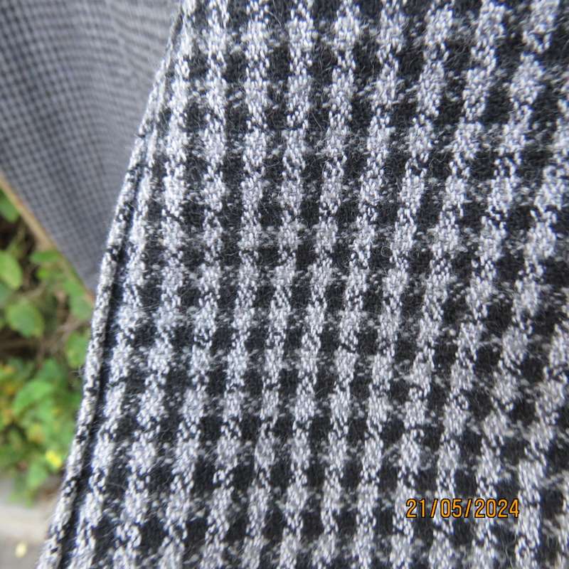 Warm black/grey check pants 70cm inner leg. Elasticated waist. Size 46/22. Owner made.Very good cond