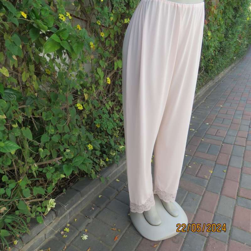 Beautiful lemonade pink nylon pajama pants with acrylic lace hems.Elastic waist. Size 40. As new