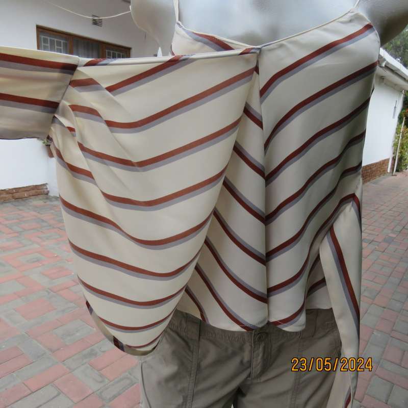 Sweet rich cream top with rust/grey stripes. Shoestring straps. Size 30 by REFINERY.Fold over.As new