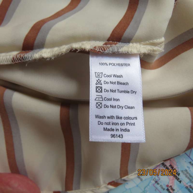 Sweet rich cream top with rust/grey stripes. Shoestring straps. Size 30 by REFINERY.Fold over.As new