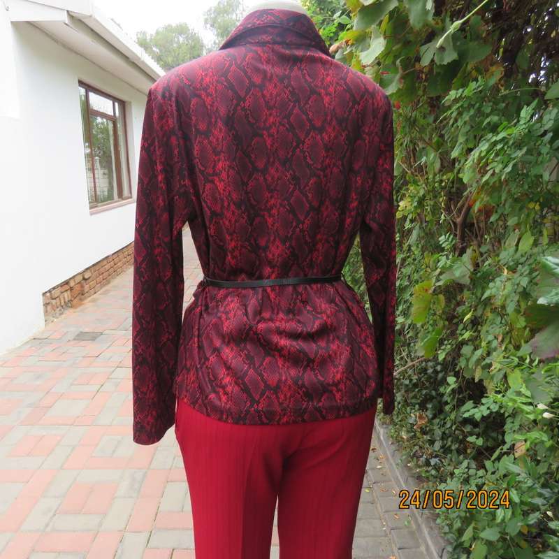 Charming red/black animal print slip over top with V neck and collar. By CHOOZIE size 38. As new.