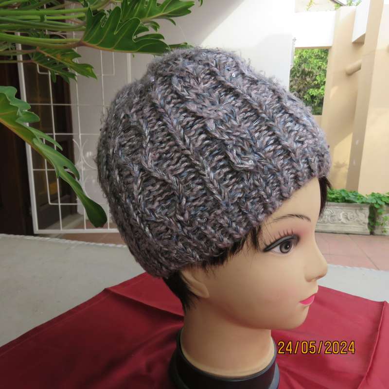 High quality grey with silver metallic fibre beanie and warm cream inner. Medium size. As new.