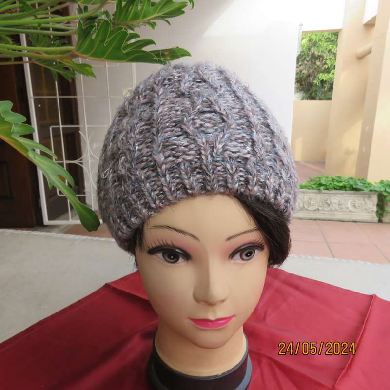 High quality grey with silver metallic fibre beanie and warm cream inner. Medium size. As new.