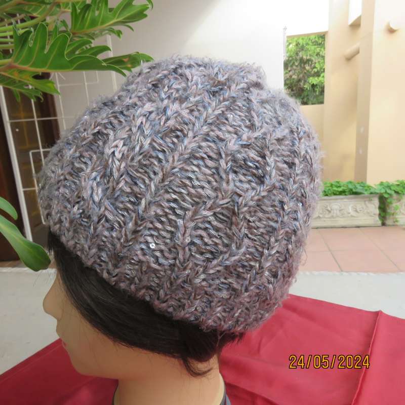 High quality grey with silver metallic fibre beanie and warm cream inner. Medium size. As new.