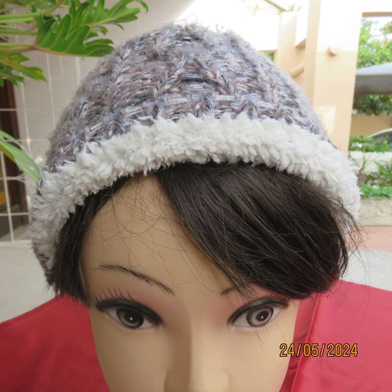 High quality grey with silver metallic fibre beanie and warm cream inner. Medium size. As new.