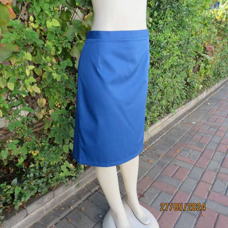 Smart admiral blue pencil skirt with zip and pleat at back. Firm polycotton. Size 40.Brand new cond