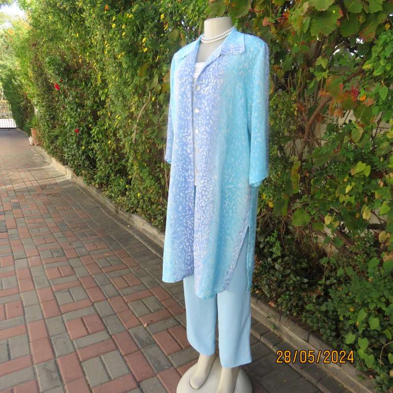 What not to love about this calf length crinkled polyester jacket/medley of blues. Size 42. New cond