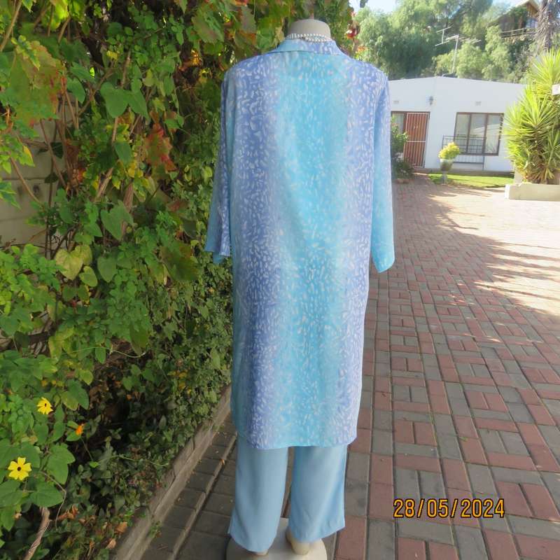 What not to love about this calf length crinkled polyester jacket/medley of blues. Size 42. New cond