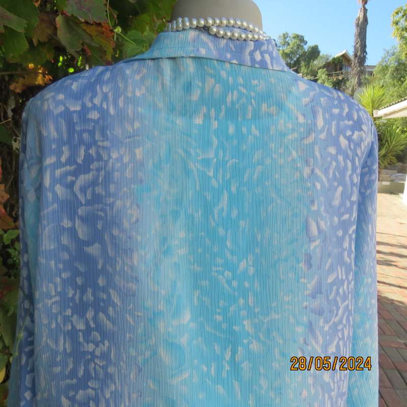 What not to love about this calf length crinkled polyester jacket/medley of blues. Size 42. New cond