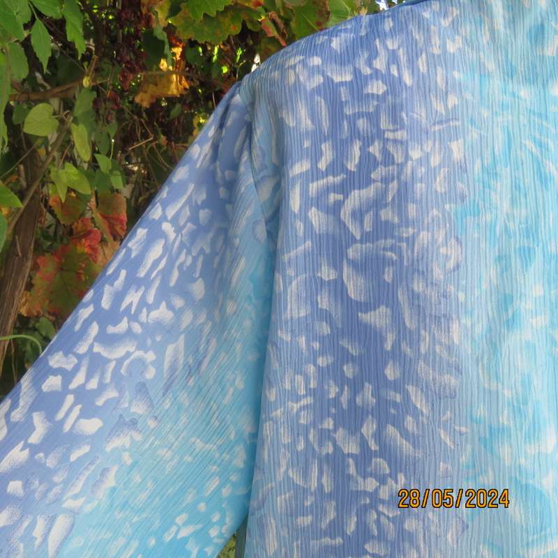 What not to love about this calf length crinkled polyester jacket/medley of blues. Size 42. New cond