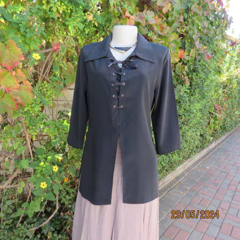 Beautiful black shiny polyester blend slip over top with elbow length sleeves. Braided front.Size 36