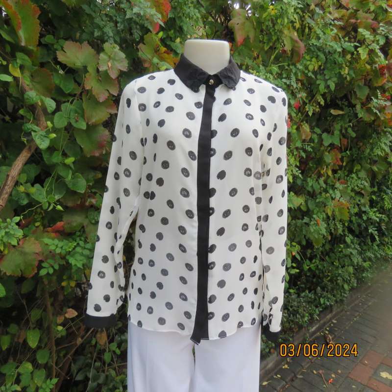 Pretty white sheer poly/black polkadot long sleeve top by RT size 36. Black collar, cuffs, front.