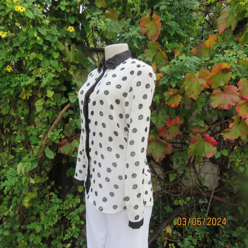 Pretty white sheer poly/black polkadot long sleeve top by RT size 36. Black collar, cuffs, front.
