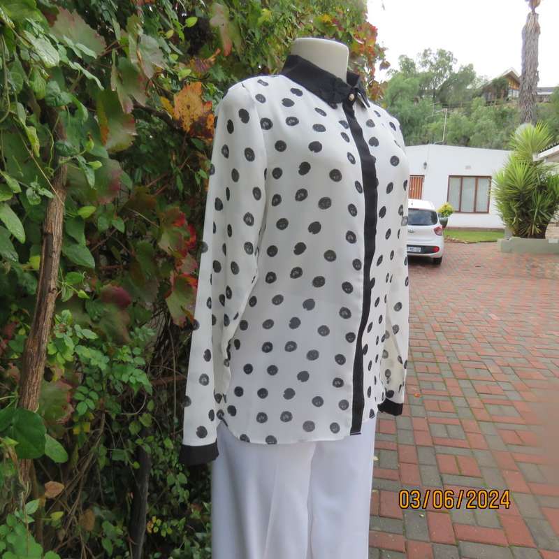 Pretty white sheer poly/black polkadot long sleeve top by RT size 36. Black collar, cuffs, front.