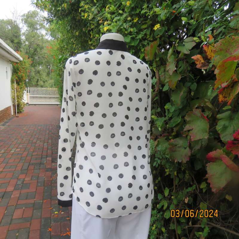 Pretty white sheer poly/black polkadot long sleeve top by RT size 36. Black collar, cuffs, front.