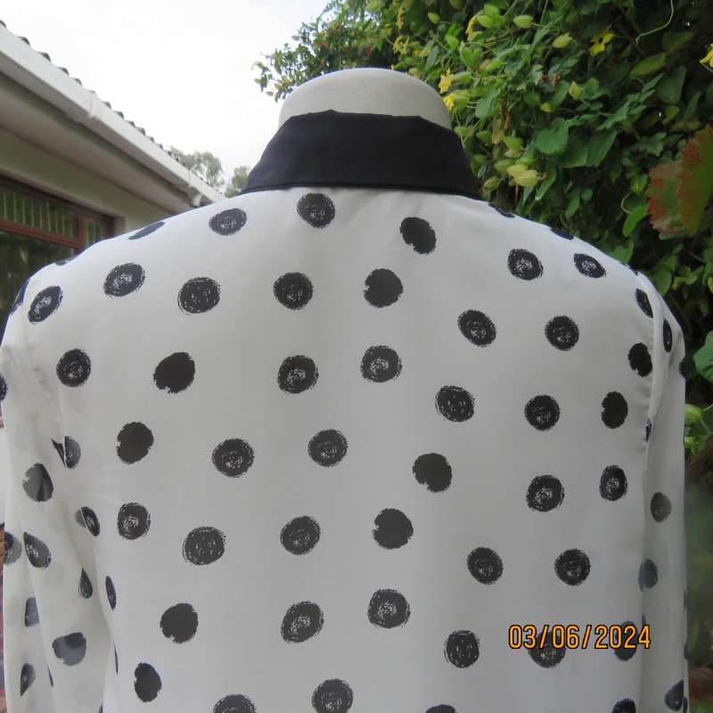 Pretty white sheer poly/black polkadot long sleeve top by RT size 36. Black collar, cuffs, front.