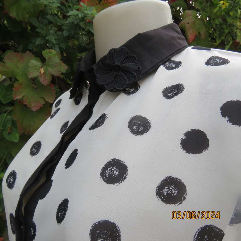 Pretty white sheer poly/black polkadot long sleeve top by RT size 36. Black collar, cuffs, front.