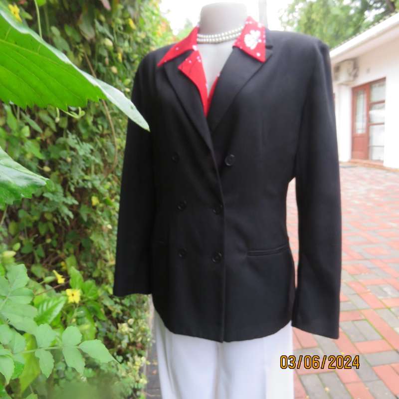 Elegant double breasted black long sleeve tailored poly/rayon jacket. Partly lined.By DIJON size 36.