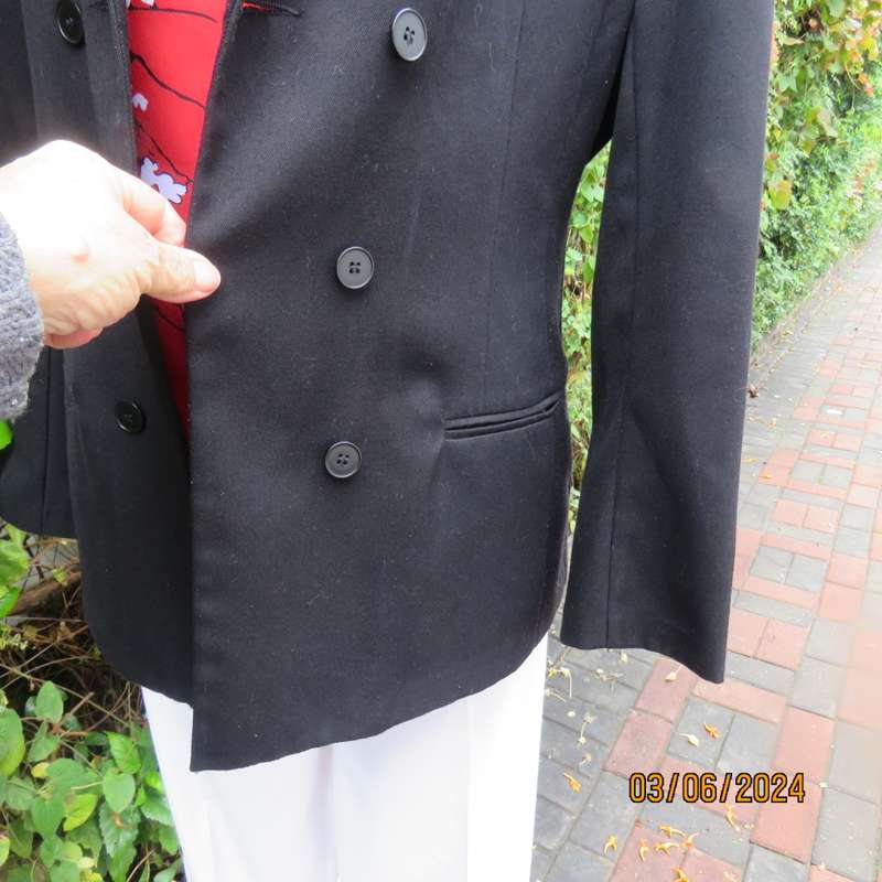 Elegant double breasted black long sleeve tailored poly/rayon jacket. Partly lined.By DIJON size 36.