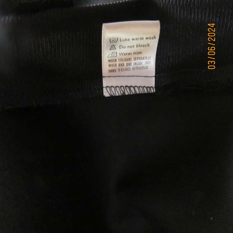 Elegant double breasted black long sleeve tailored poly/rayon jacket. Partly lined.By DIJON size 36.
