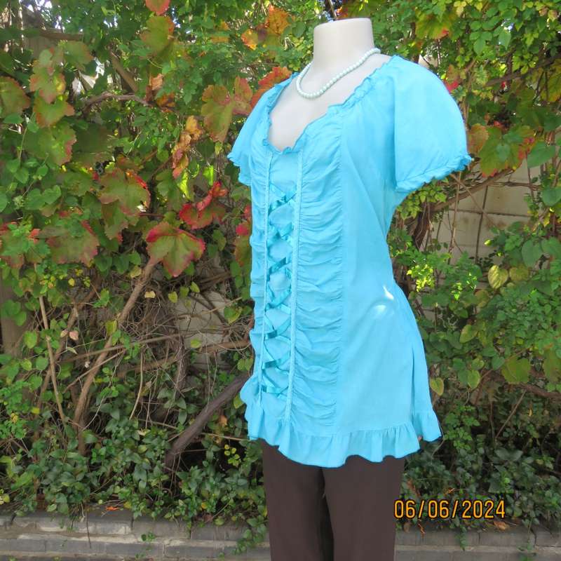 Feminine aquamarine blue peasant style top. Zip at side. Front gathered/decorated panels.Size 42.